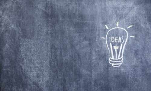 drawn-illuminated-idea-light-bulb-drawn-with-chalk-blackboard3 why hire a business coach